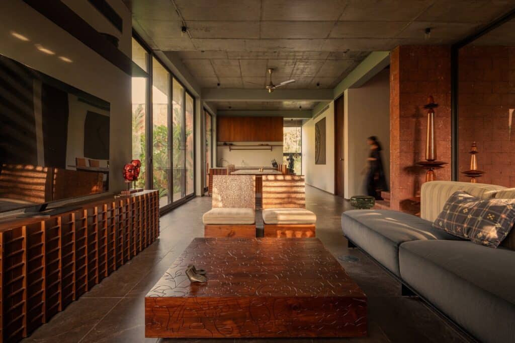 Sumish residence in Bayanur, Kerala, exemplifying the integration of local cultural heritage, traditional architecture, natural materials, open-plan interiors, and sustainable design strategies, harmonizing indoor and outdoor spaces while reflecting the region's spiritual and environmental context.