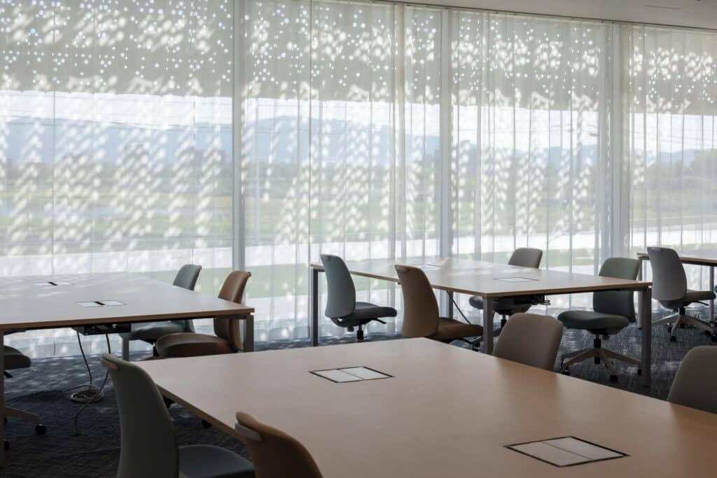 Hair care products factory in Kosatsu, designed to integrate environmental sustainability, YOSHIZU reed screen, water and energy management, with flexible workspaces.