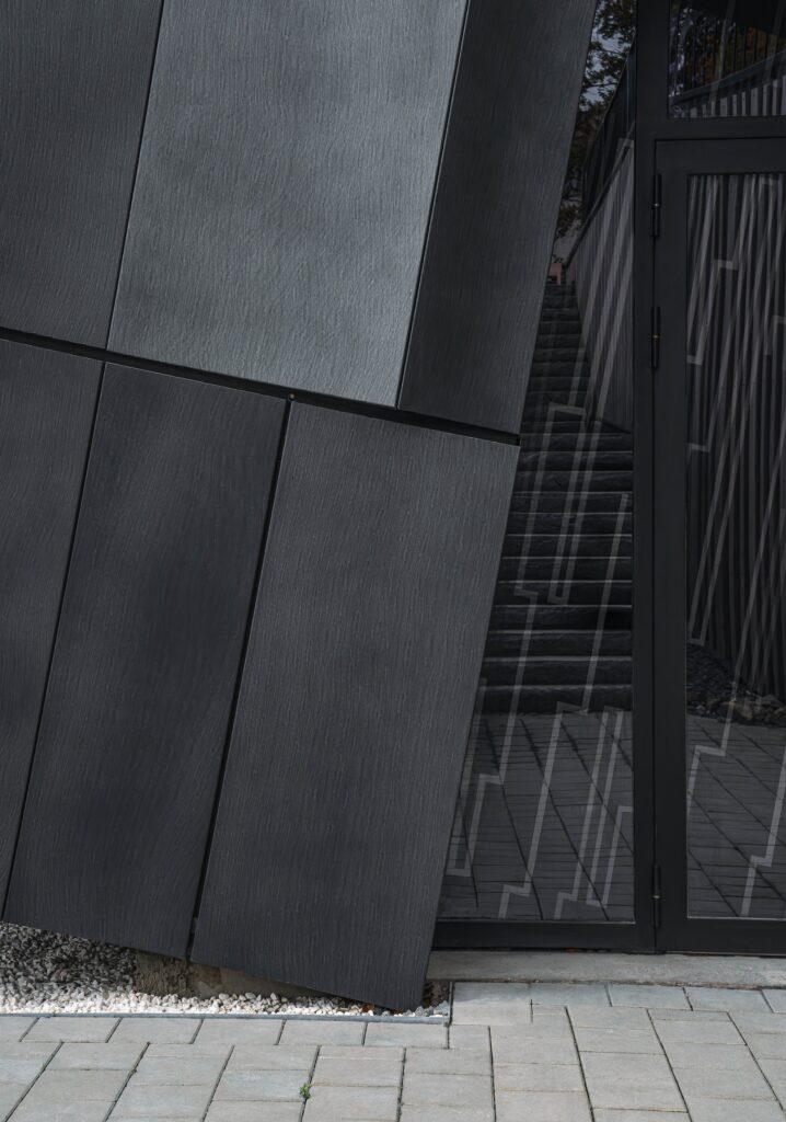 Kalleb&auml;cks Terrasser architectural project exploring the interaction between sculptural building forms, rocky terrain, innovative materials, eco-friendly concrete, and unique interior lighting, offering a comprehensive experience of transitional spaces between nature and architecture.