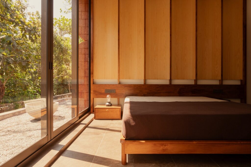 Sumish residence in Bayanur, Kerala, exemplifying the integration of local cultural heritage, traditional architecture, natural materials, open-plan interiors, and sustainable design strategies, harmonizing indoor and outdoor spaces while reflecting the region's spiritual and environmental context.