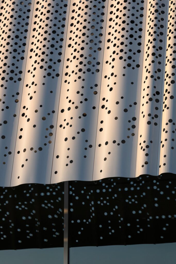 Hair care products factory in Kosatsu, designed to integrate environmental sustainability, YOSHIZU reed screen, water and energy management, with flexible workspaces.