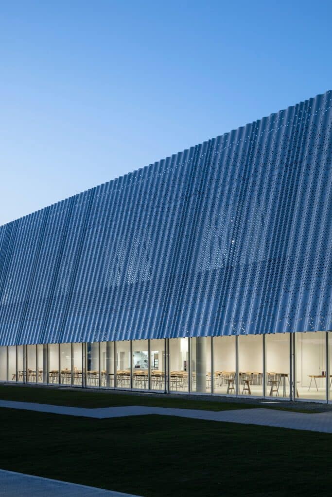 Hair care products factory in Kosatsu, designed to integrate environmental sustainability, YOSHIZU reed screen, water and energy management, with flexible workspaces.