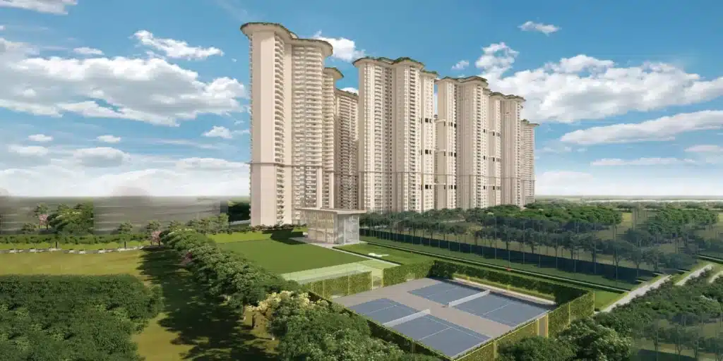 Aerial view of a branded residential tower complex in Gurgaon with curved forms and landscaped grounds.