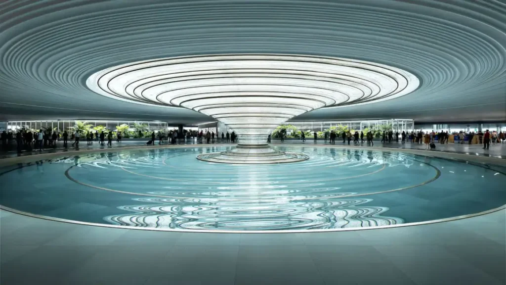 معلم دائري وهيكل سقف حلقي داخل محطة مطار جادوكدو الجديد، يعكس التصميم المستوحى من البيئة البحرية.