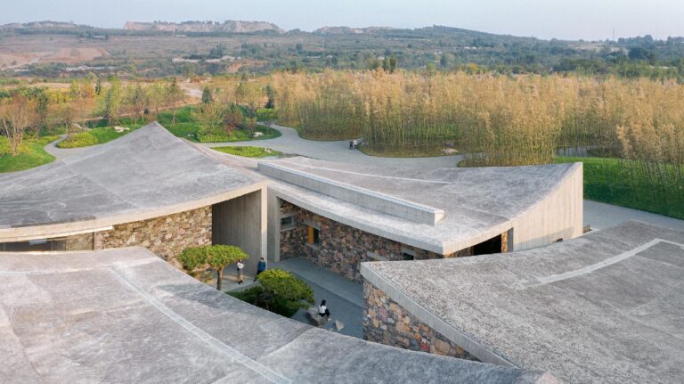 An aerial view of the Jingdezhen Imperial Kiln Museum designed by Zhu Pei, showcasing its unique vaulted structures, which is an example of [Poetic Architecture]