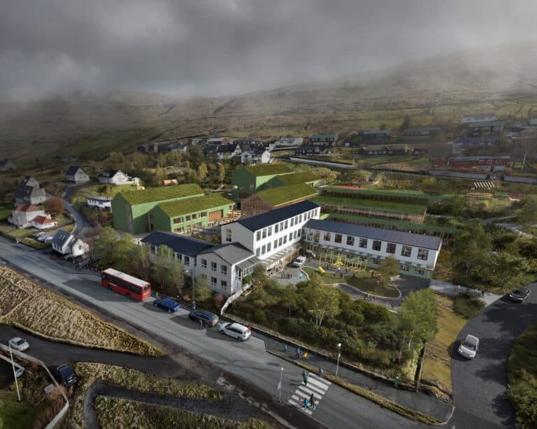 Aerial view of Henning Larsen's Glyvra School "learning village" design, showing the cluster of buildings integrated into the Faroe Islands landscape. Glyvra School.