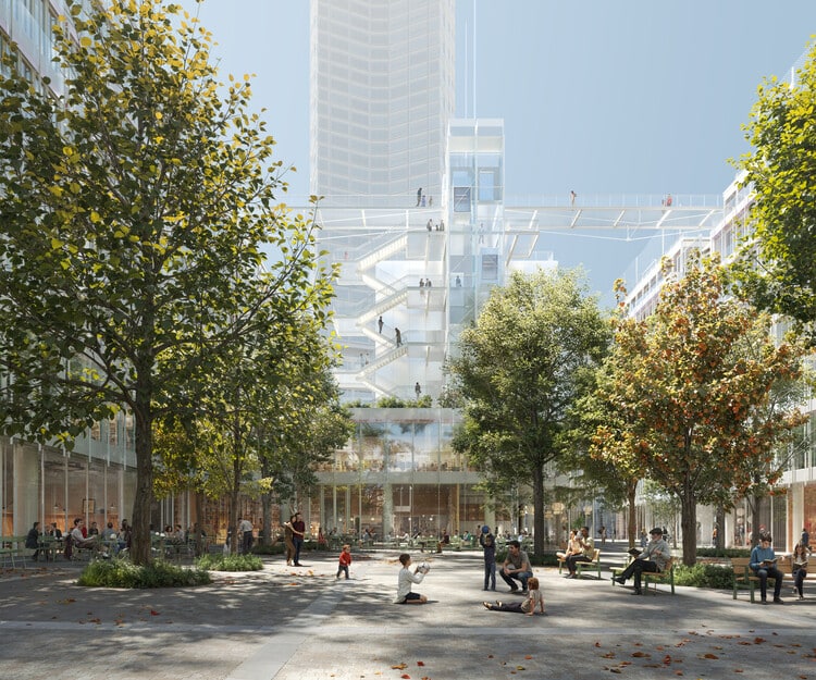 A view from the new tree lined public square at the heart of the Montparnasse redevelopment, showing people enjoying the space in front of a transparent, modern building designed by Renzo Piano Building Workshop.