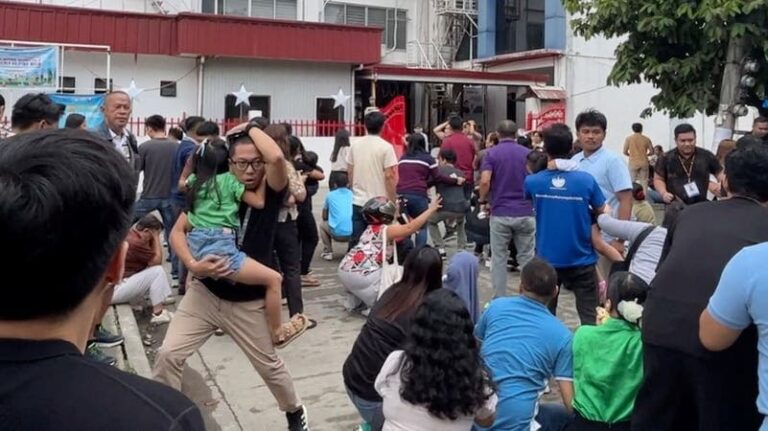 Seismic-resistant design (disenyo ng bahay na ligtas sa lindol) failure: a residential building tilts severely after an earthquake, showing structural collapse in non-reinforced concrete.