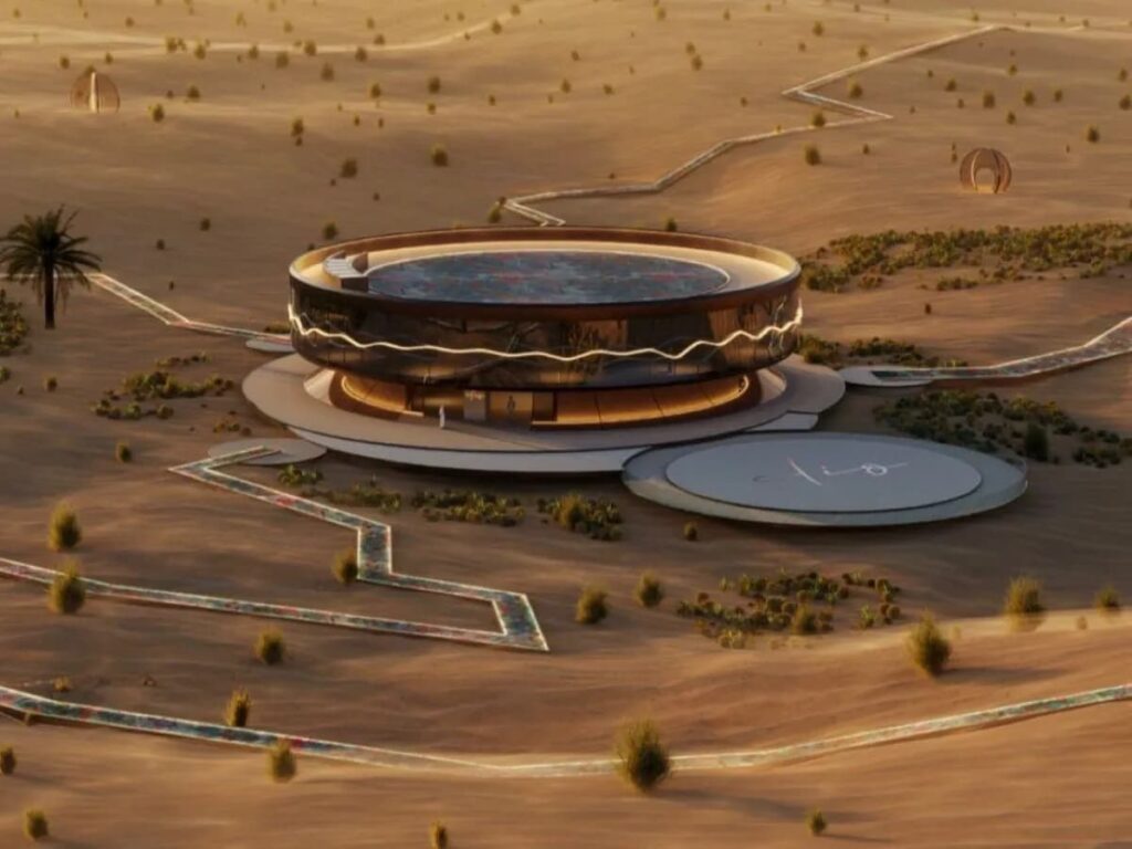 عرض جوي لمنزل كليو، الهيكل الدائري المركزي لمشروع تفاعلي فني بطول 10 كيلومترات في صحراء مغْرَم بدبي، يضم مسارات وحداتية ومصمم متكامل مع البيئة الصحراوية.