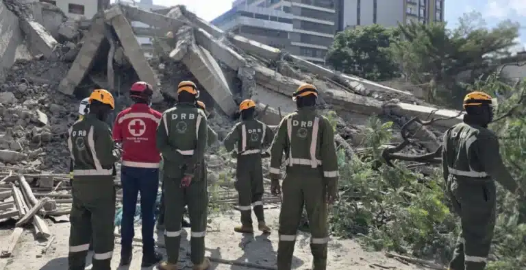 Disaster Response Team assessing rubble at the site of a collapsed 16-story building in Nairobi structural safety failure.