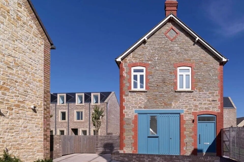 A street view of the Accordia housing project in Cambridge, an example of quality housing that follows ambitious design guidelines.