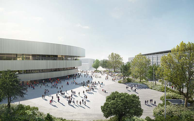 Interior view of the Milano Santa Giulia Arena during an ice hockey game, showing thousands of spectators in the seating tiers surrounding the rink.
