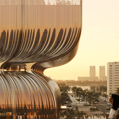 Night view of the Hanwha Galleria, with vibrant digital projections illuminating the tower's glass skin.