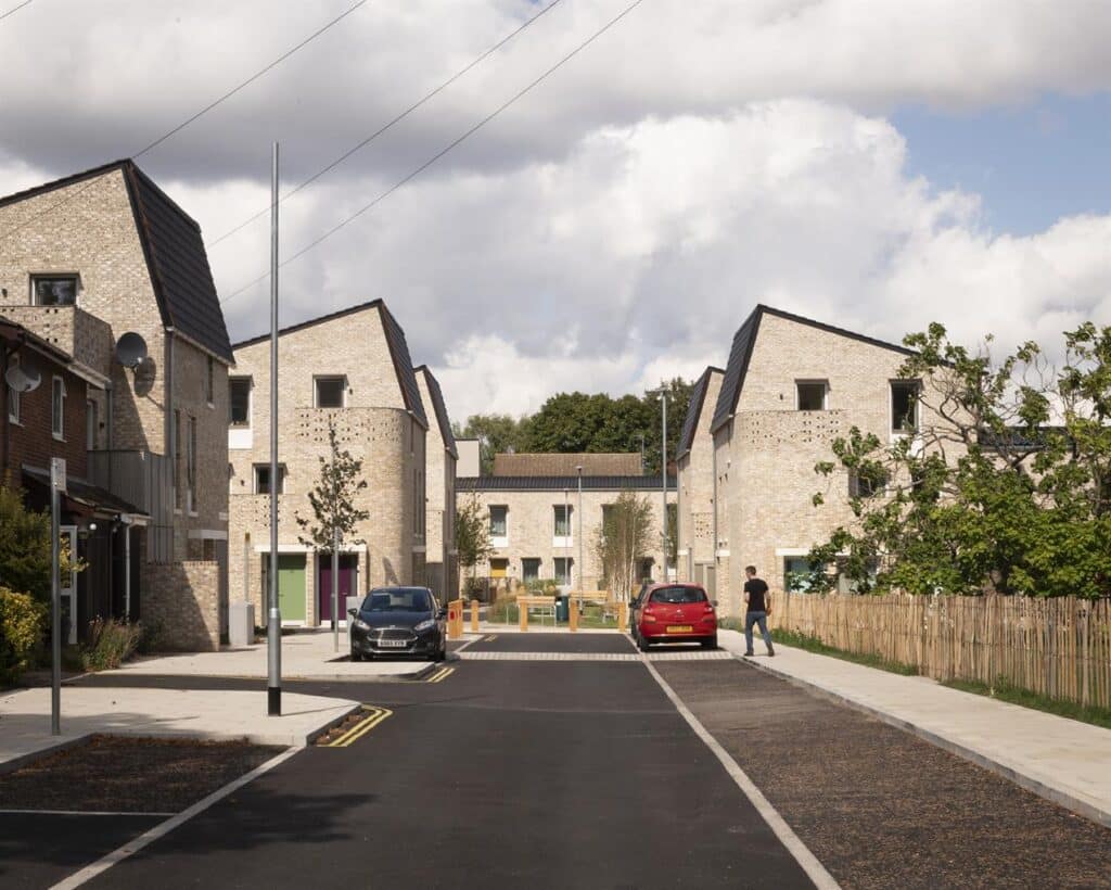 An aerial view of Poundbury, a mixed-use community in Dorset, reflecting the new UK design guidelines for walkable, beautiful, and sustainable neighborhoods.
