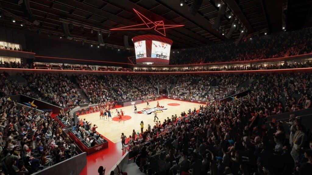 تصور داخلي لساحة وين في ولونجونج مجهزة لمباراة كرة سلة، مع تسليط الضوء على الملعب ومقاعد المتفرجين.