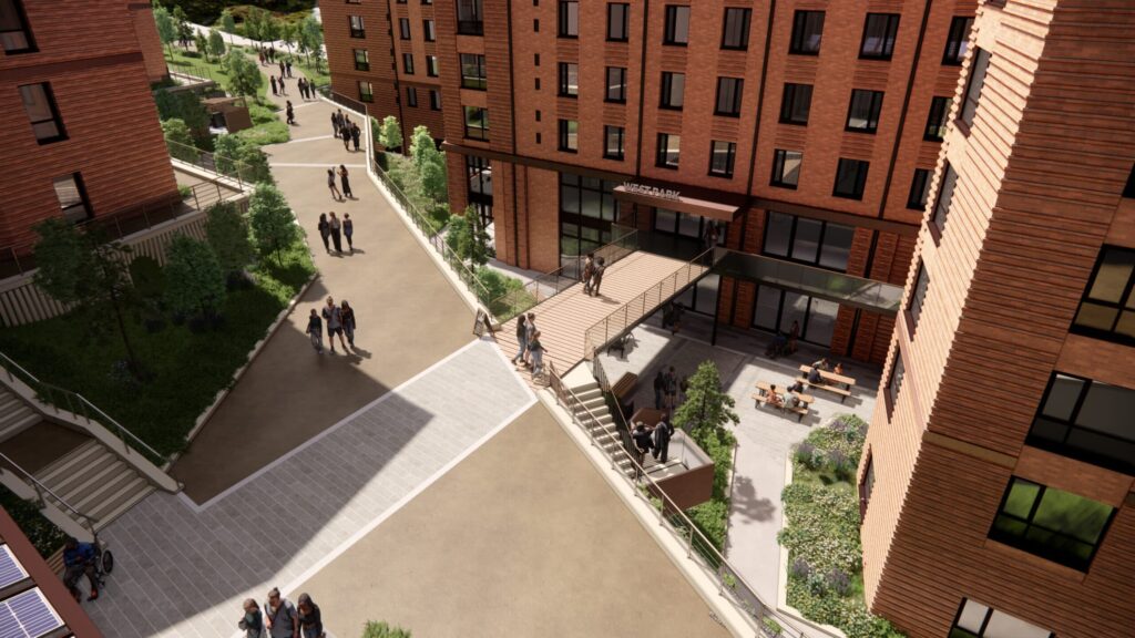 عرض جوي لمخطط سكني طلابي يظهر ممرات للمشاة، مناطق خضراء، ومبانٍ مغطاة بالطوب  إكستر، المملكة المتحدة