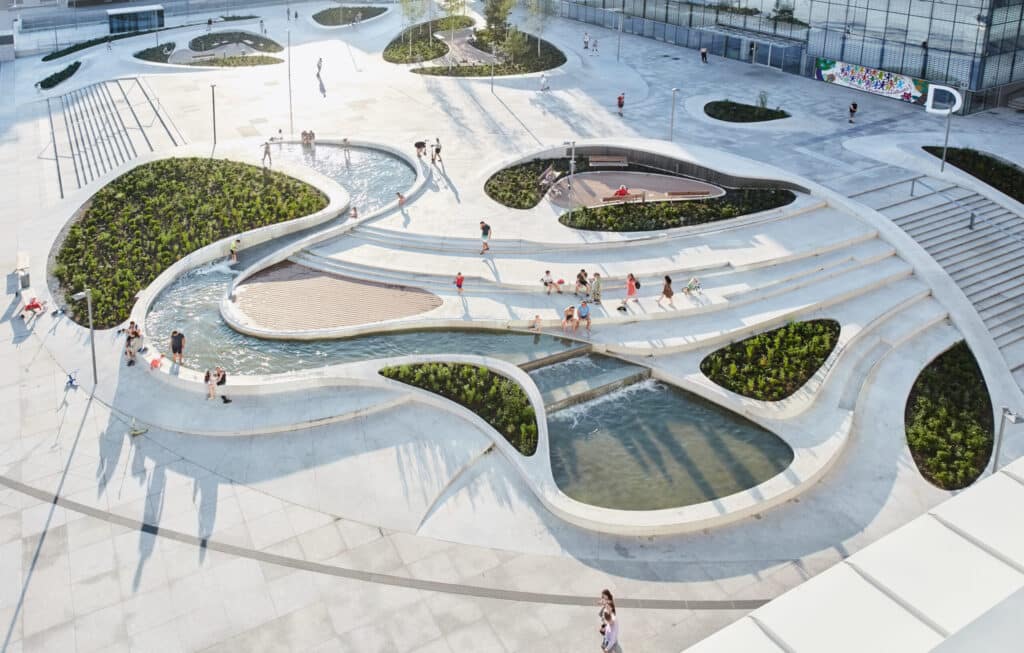 Terraced public space with seating and landscape elements in public spaces architectural design