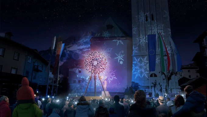 A close-up rendering of the Olympic cauldron in its closed state, emphasizing the metallic, interlaced surface inspired by Leonardo da Vinci's knots.