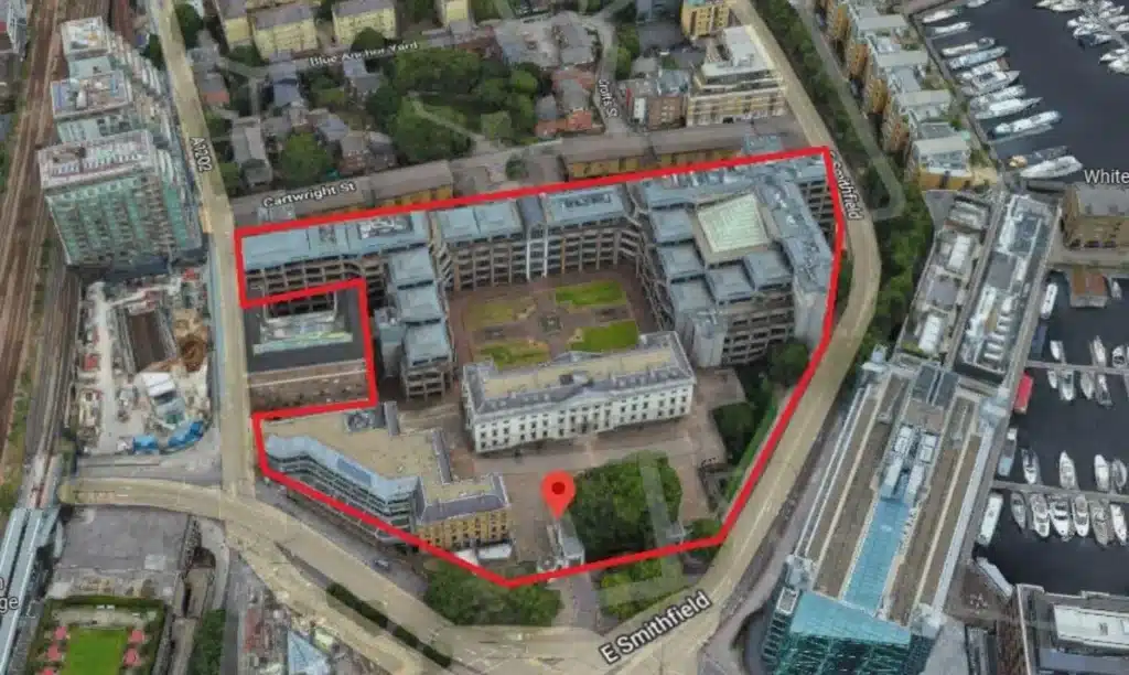 Aerial map view of Royal Mint Court in London, outlined in red to show the site boundary for the proposed Chinese Embassy in London, with surrounding streets and adjacent waterfront visible.