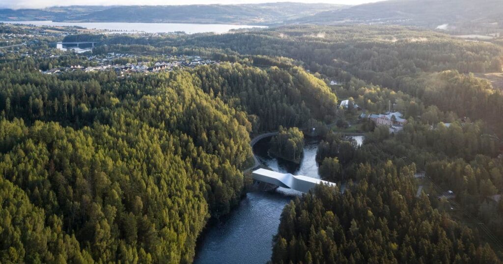 Architectural sustainability in context The Twist at Kistefos Museum spans a river within a dense Norwegian forest, blending built form with ecological terrain.