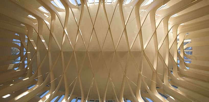 Exterior of Saltmarsh House on the Isle of Wight by N&iacute;all McLaughlin Architects, showing its board-marked concrete structure facing the water.