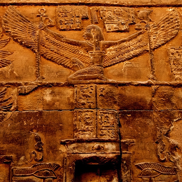 Close-up of carved Ma&rsquo;at relief on sandstone at Luxor Temple, symbolizing cosmic balance and order.