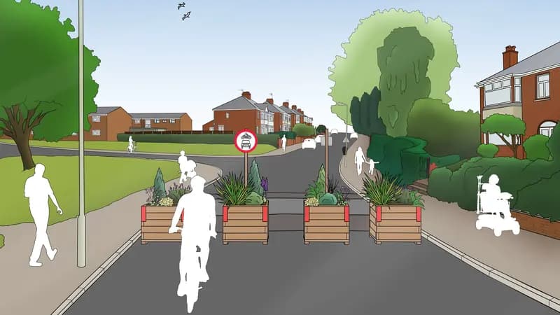 Urban street redesign with planters, pedestrian zones, and accessibility features  Exeter, UK