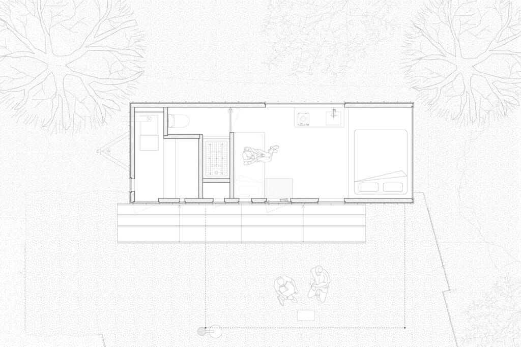Architectural floor plan of Earthboat Cave showing the arrangement of the bed, kitchen, bathroom, and outdoor deck area.