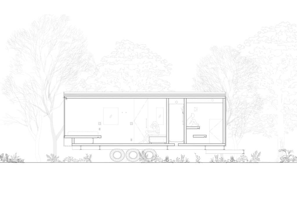 Architectural section drawing of Earthboat Cave showing the internal layout including the sleeping area, kitchen, and bathroom facilities on a mobile chassis.
