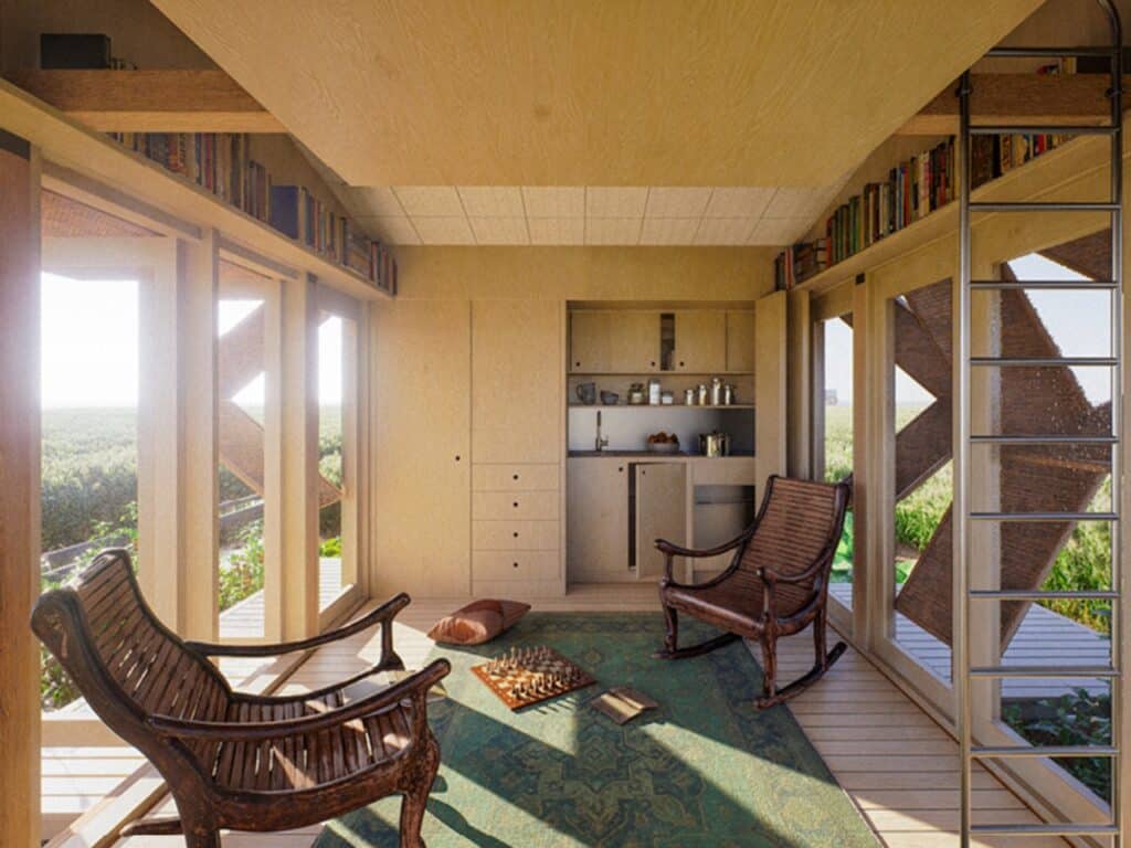 Interior view of a 25 square meter tiny house showing a compact kitchen, rocking chairs, and warm plywood finishes.