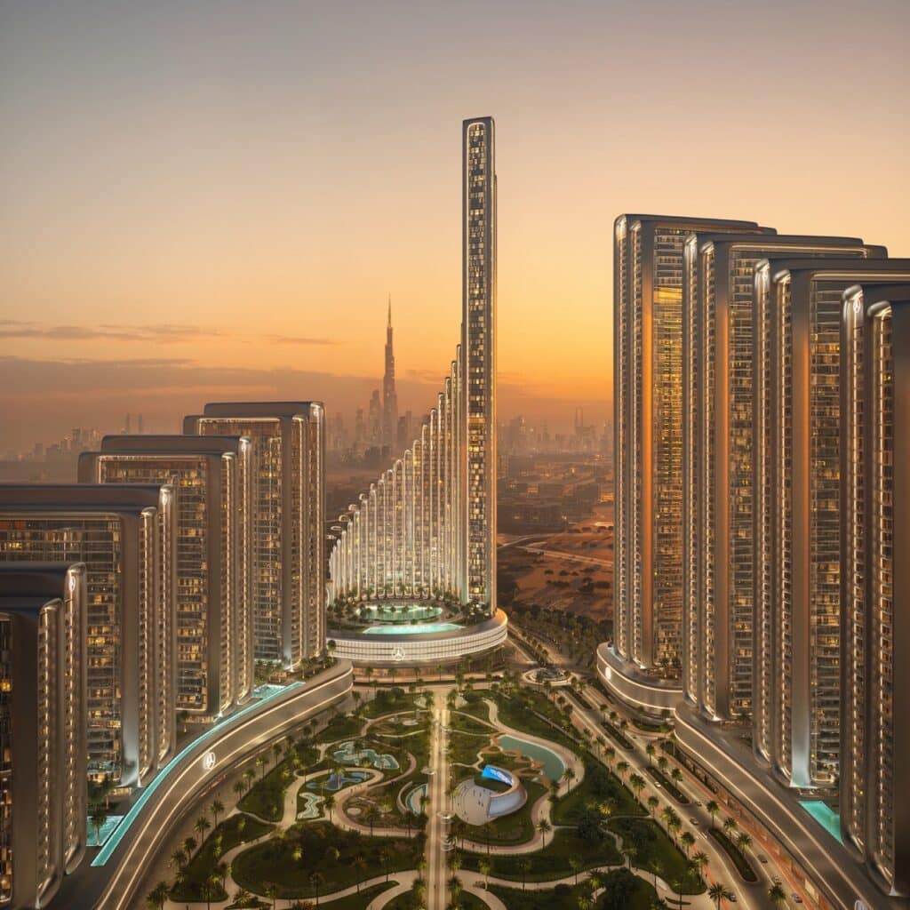 A wide-angle sunset view of Binghatti City in Dubai, showing the central Vision Iconic Tower surrounded by residential towers and lush green parks.