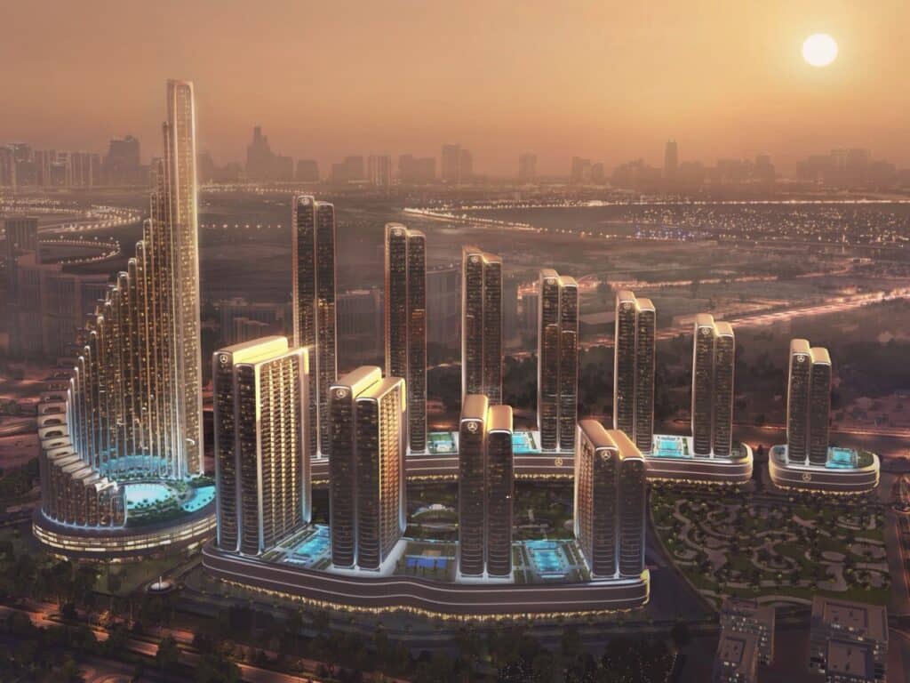 Perspective view of Binghatti City residential skyscrapers in Dubai during golden hour, showing the podium levels and rooftop amenities.