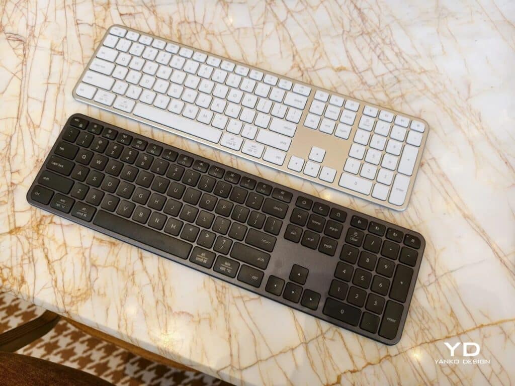 Top-down view of two Satechi Slim EX3 keyboards in silver and space gray showing the full layout.