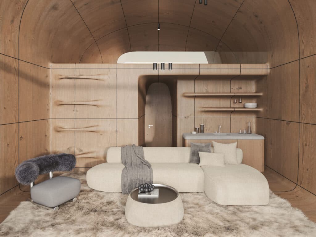 Central social living area of AltiHut featuring curved wooden walls, a cozy sofa, and a small kitchenette.