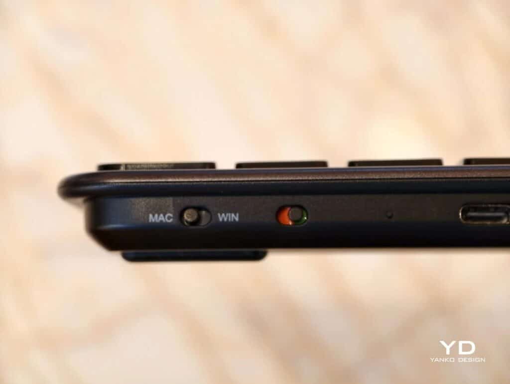 Close-up of the side profile of a space gray Satechi keyboard showing the Mac and Windows toggle switch.