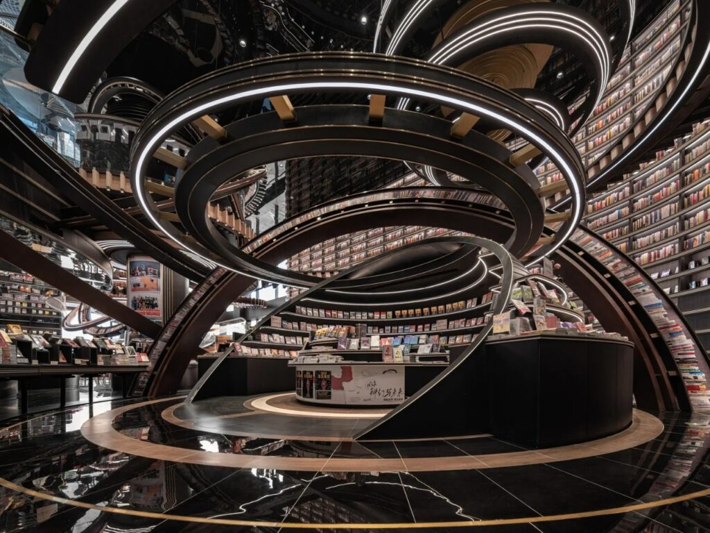 Ground-level view of the mirrored floor reflecting the massive circular bookshelf structures in Huai&rsquo;an Zhongshuge.