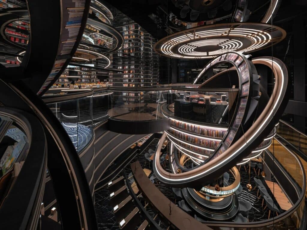 Overview of the multi-level library space with suspended rings and integrated caf&eacute; seating areas in Huai&rsquo;an Zhongshuge.