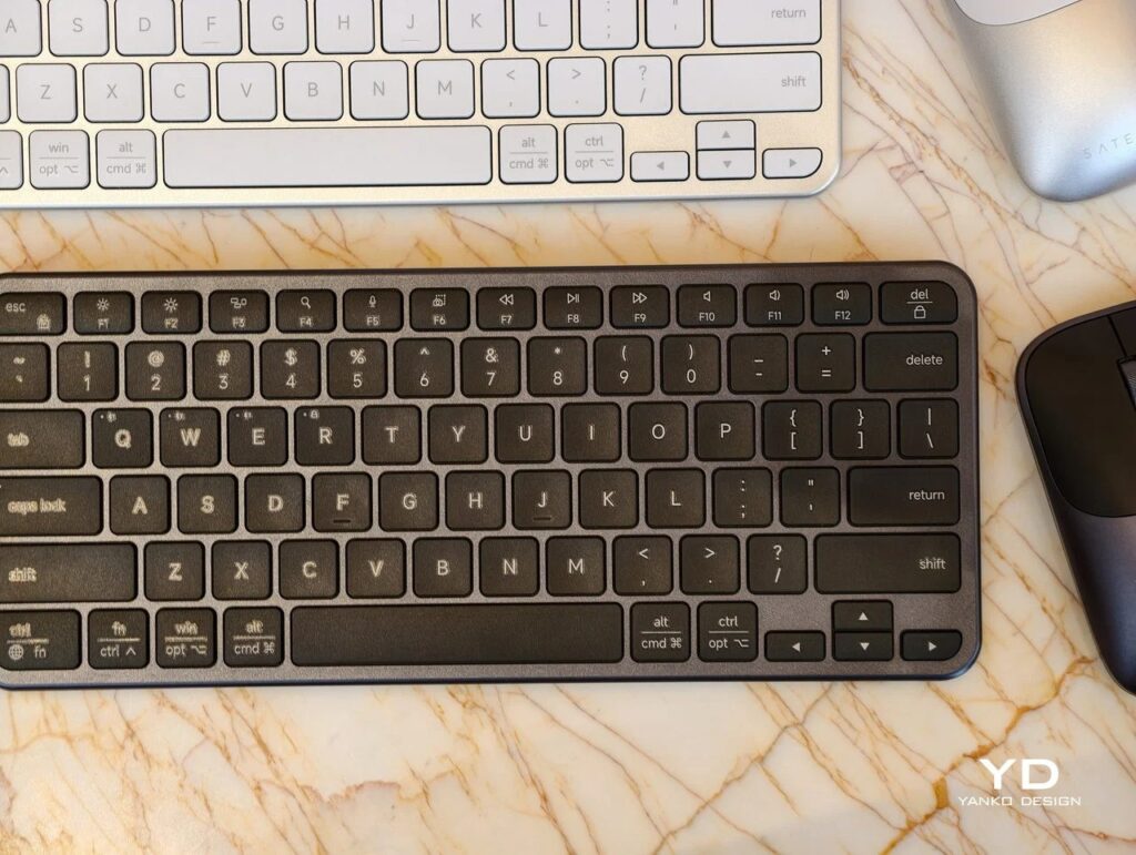 Detailed top view of the space gray Satechi Slim EX1 keyboard keys showing multi-device pairing buttons.