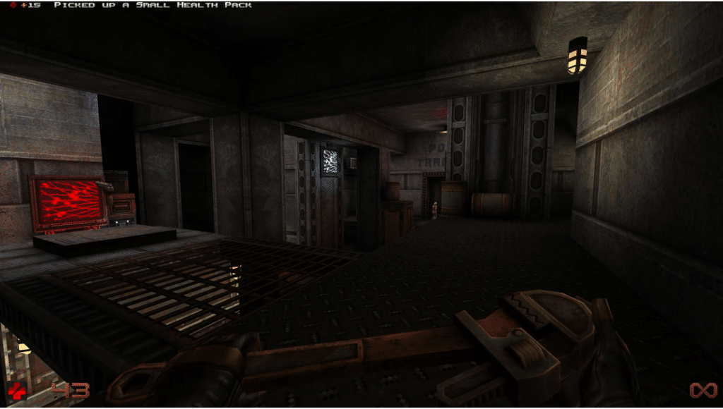 A first-person view from a retro-style video game showing a character holding a large, rusty pipe wrench. The scene is a dark, industrial corridor with metal grating on the floor, glowing computer screens, and low-fidelity textures.