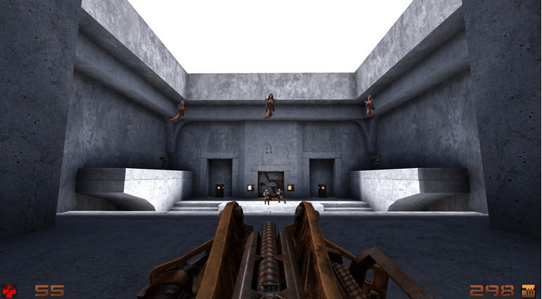 A first-person view of an old-school shooter game set in a concrete courtyard with enemies standing near a doorway and a large mechanical weapon in the foreground.