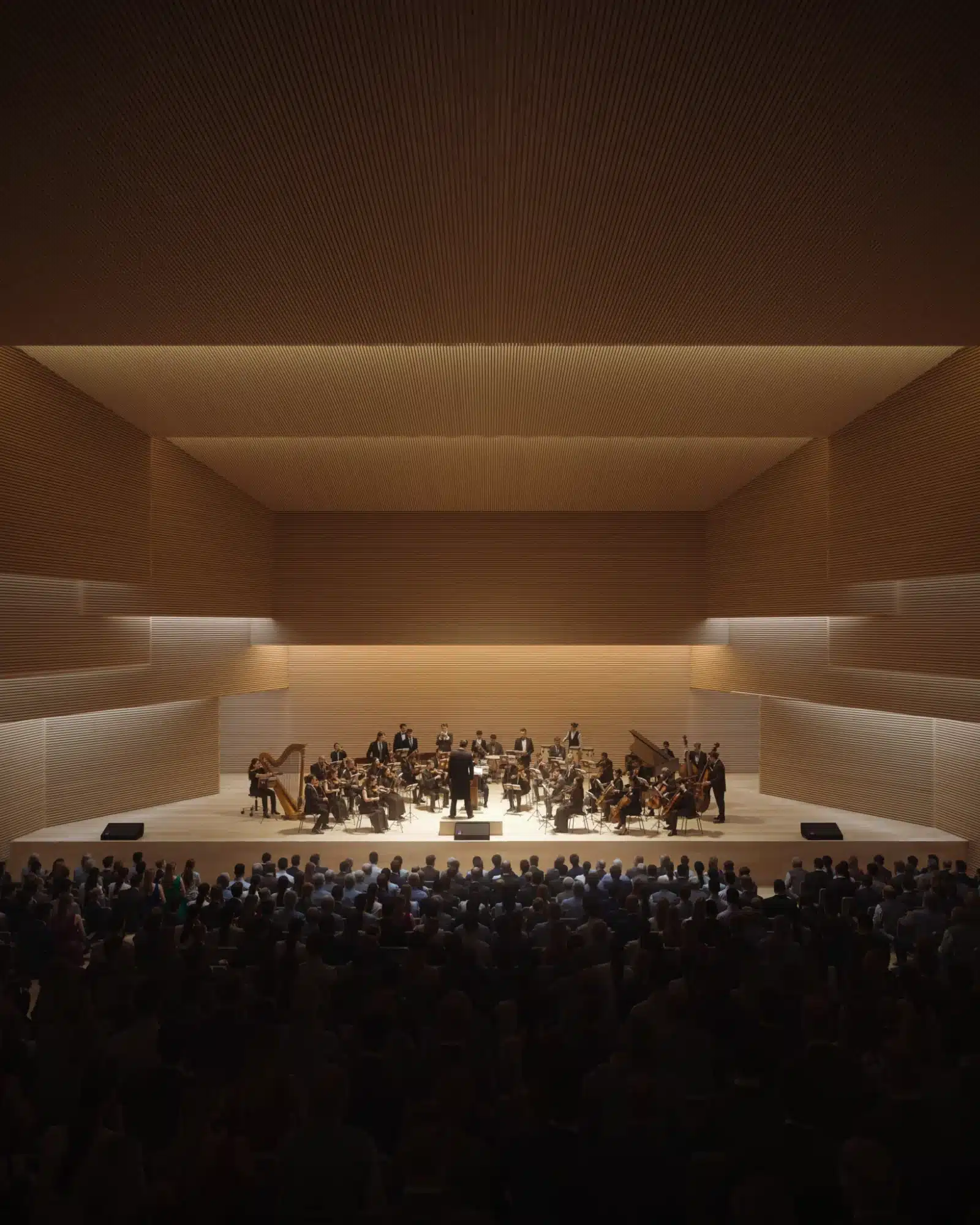 Interior of the Spiral Library concert hall featuring horizontal acoustic timber slatting on walls and ceilings with an orchestra performing on stage.