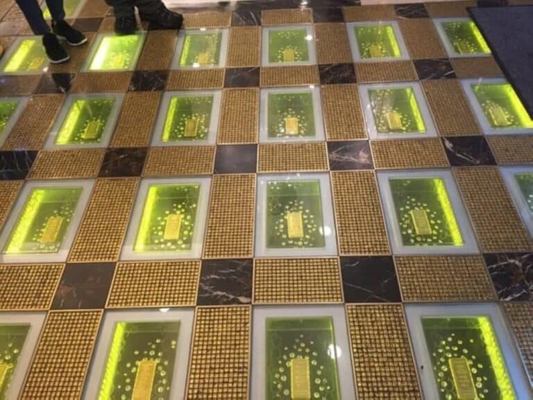 A view down the Grand Emperor Hotel's famous Gold Floor, with rows of one kilogram gold ingots visible under the glass walkway.