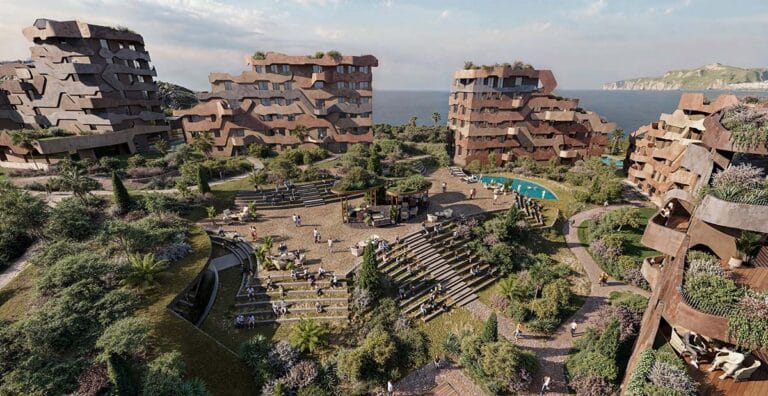 Aerial view of a terraced residential complex featuring a central stepped plaza and wavy earth-toned facades overlooking the sea.