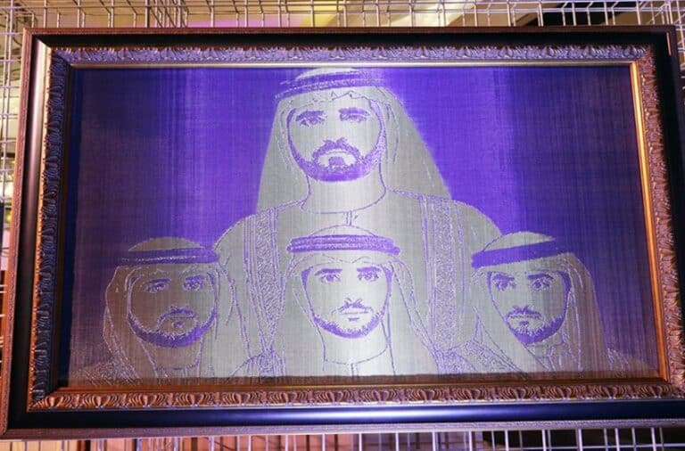 Detailed macro shot of Woven Metal Mesh, highlighting its intricate texture and metallic sheen under gallery lighting.