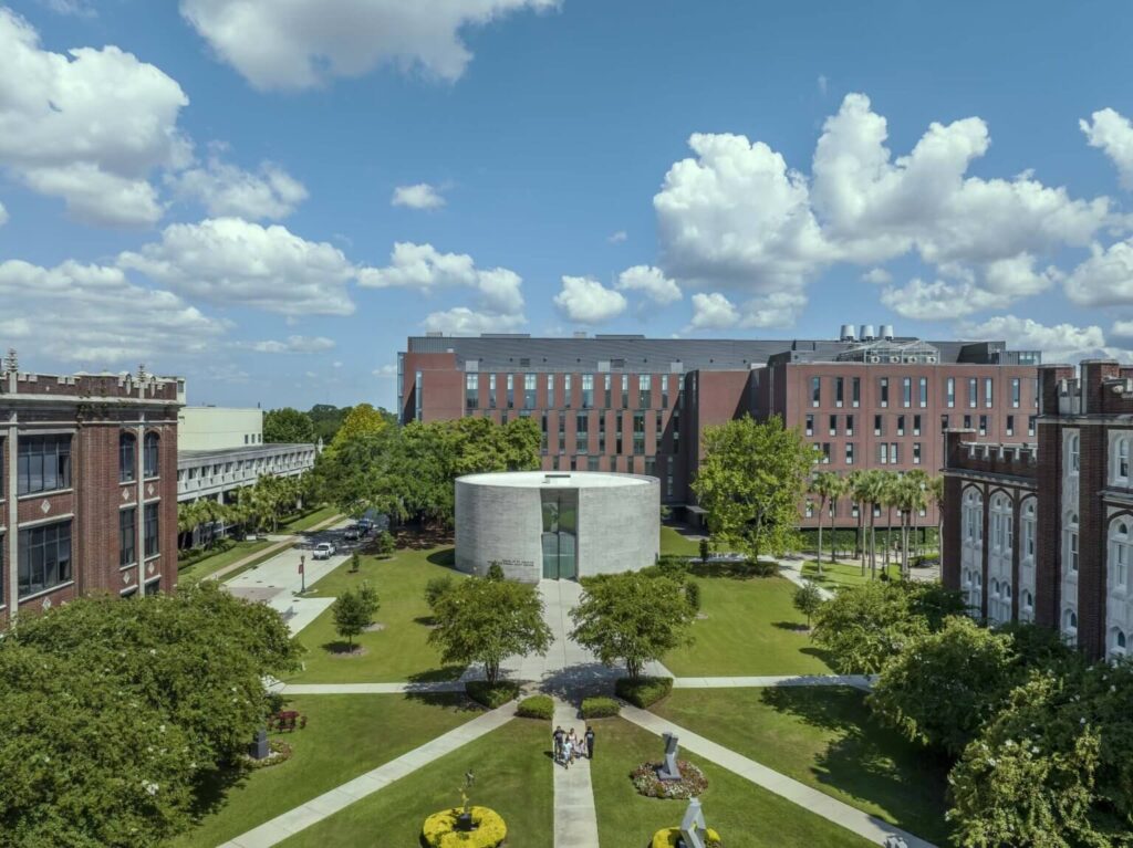 Aerial view of the Circular Chapel situated centrally within the green quad of the Loyola University campus.