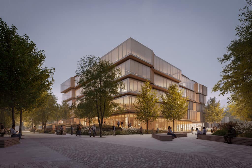 Aerial night shot of the Spiral Library highlighting the vortex roof shape, solar panels, and central courtyard.