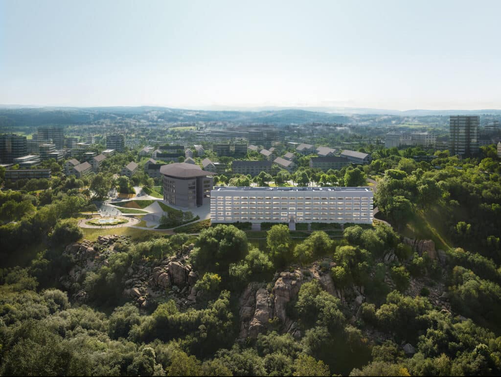 Interior event space inside the Yerevan Educational Center featuring a large glass wall framing a view of Mount Ararat at twilight.