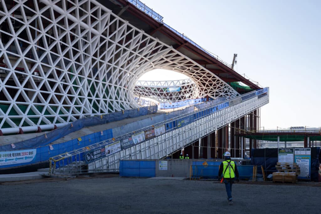 Detailed view of the steel framework of the Busan Opera House, showcasing the complex curvature of the design.