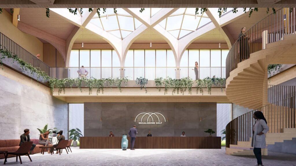 Interior view of the Megalodome Indoor Golf Course, showing a vast green with sand bunkers under a high domed ceiling.