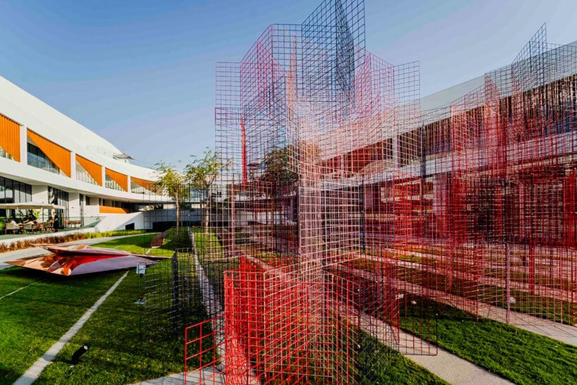 A framed Woven Metal Mesh artwork displayed on a gallery wall, depicting a layered visual composition without ink or paint.